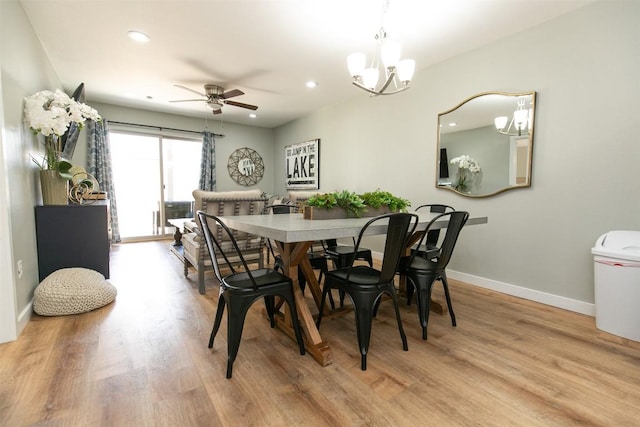 104 Cove E Unit 103, Horseshoe Bay, TX 78657 - dining area featuring light wood finished floors, baseboards, a chandelier, a ceiling fan, and recessed lighting