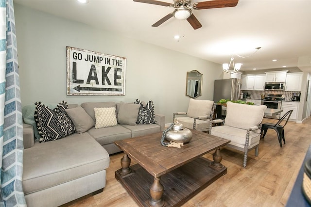104 Cove E Unit 103, Horseshoe Bay, TX 78657 - living room with a ceiling fan, recessed lighting, and light wood-style floors