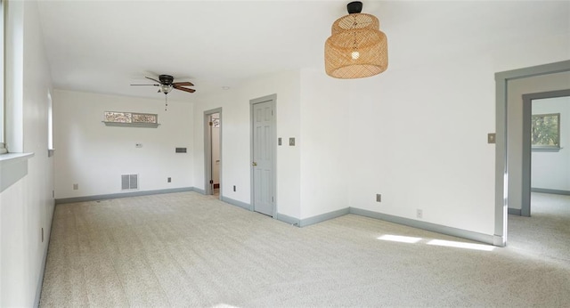 13918 Hummingbird Ln, Austin, TX 78732 - spare room featuring light carpet, ceiling fan, and baseboards