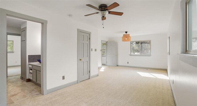 13918 Hummingbird Ln, Austin, TX 78732 - unfurnished bedroom featuring light carpet and baseboards
