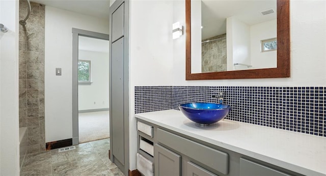 13918 Hummingbird Ln, Austin, TX 78732 - bathroom with vanity and tasteful backsplash