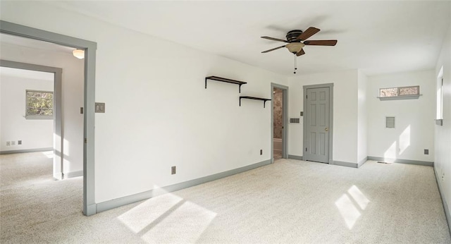 13918 Hummingbird Ln, Austin, TX 78732 - unfurnished bedroom with light colored carpet, baseboards, and a ceiling fan