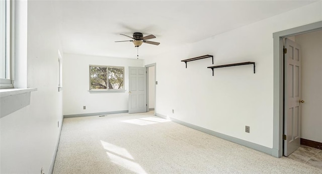 13918 Hummingbird Ln, Austin, TX 78732 - unfurnished bedroom featuring baseboards, a ceiling fan, and light carpet
