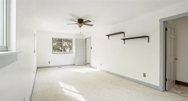 13918 Hummingbird Ln, Austin, TX 78732 - unfurnished room with a ceiling fan, baseboards, and light colored carpet