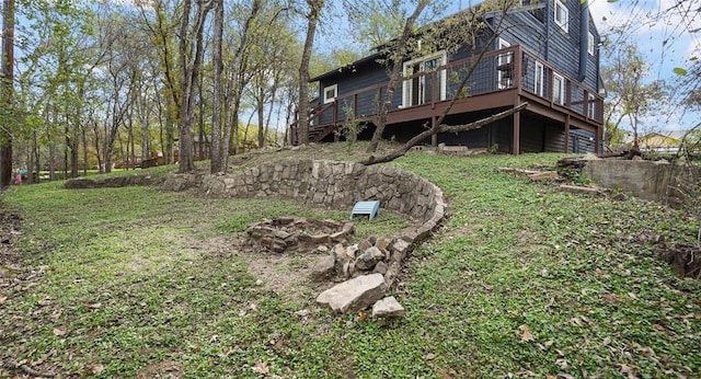 13918 Hummingbird Ln, Austin, TX 78732 - view of grassy yard featuring an outdoor fire pit and a deck