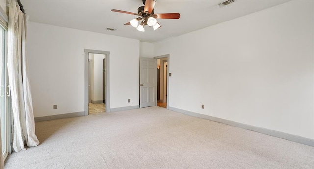13918 Hummingbird Ln, Austin, TX 78732 - unfurnished bedroom with light colored carpet, baseboards, and a ceiling fan