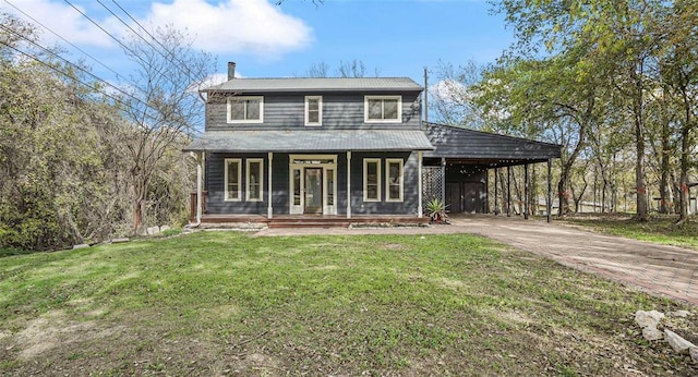 13918 Hummingbird Ln, Austin, TX 78732 - view of front of property featuring a porch, concrete driveway, a front yard, and a carport