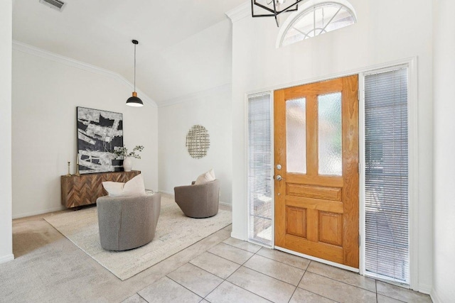 7403 Ponoma Trl, Austin, TX 78749 - foyer entrance featuring plenty of natural light, lofted ceiling, ornamental molding, and tile patterned floors