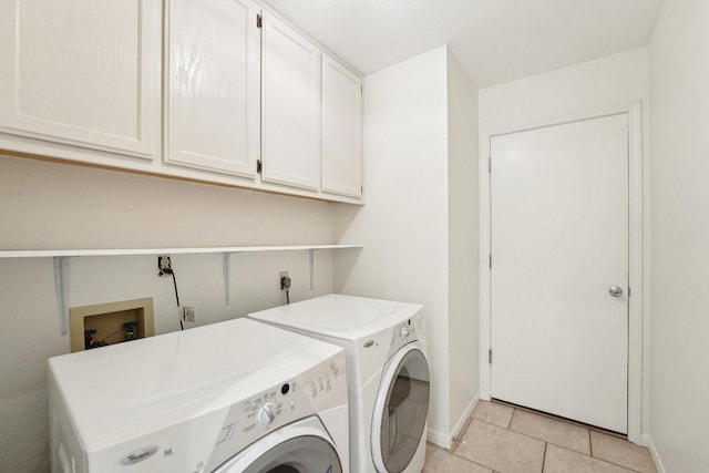 7403 Ponoma Trl, Austin, TX 78749 - laundry area with cabinet space, separate washer and dryer, baseboards, and light tile patterned flooring