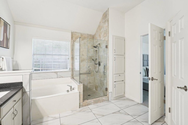 7403 Ponoma Trl, Austin, TX 78749 - ensuite bathroom with a garden tub, a stall shower, marble look tile flooring, vanity, and lofted ceiling