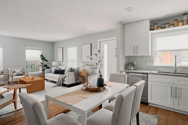 dining area featuring plenty of natural light and dark wood finished floors