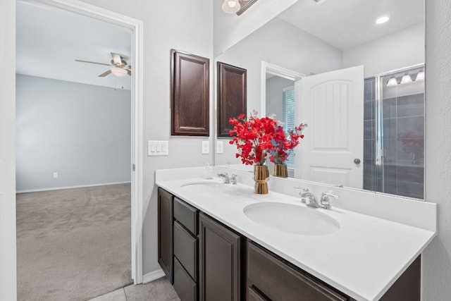 1180 Verna Brooks Way, Kyle, TX 78640 - bathroom with ceiling fan, double vanity, and baseboards