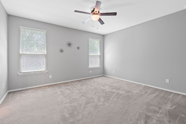 1180 Verna Brooks Way, Kyle, TX 78640 - carpeted spare room featuring healthy amount of natural light, ceiling fan, and baseboards