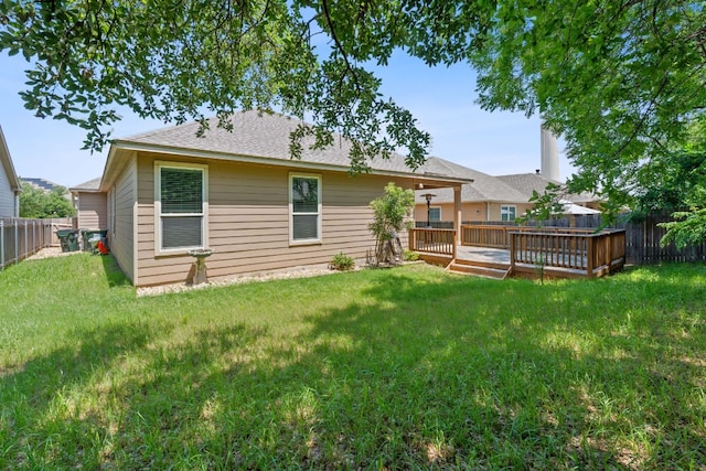 1180 Verna Brooks Way, Kyle, TX 78640 - rear view of house featuring a wooden deck and a shingled roof