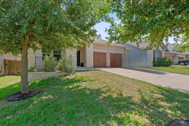 1180 Verna Brooks Way, Kyle, TX 78640 - view of property hidden behind natural elements with a garage, driveway, and stone siding