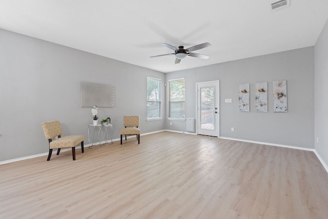1180 Verna Brooks Way, Kyle, TX 78640 - sitting room featuring light wood-type flooring, a ceiling fan, and baseboards