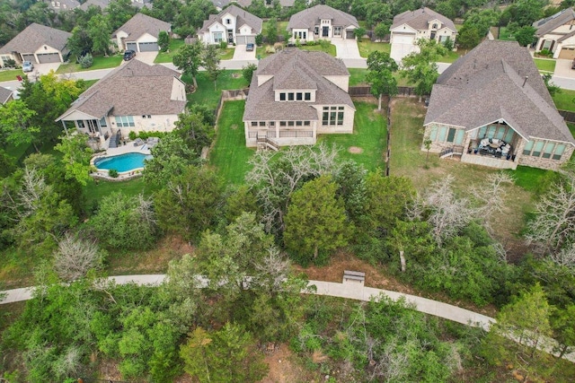 aerial perspective of suburban area featuring a pool