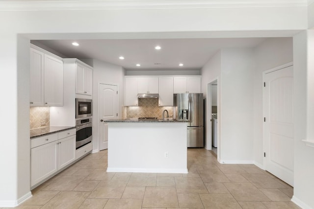 9617 Solana Vista Loop Unit A, Austin, TX 78750 - kitchen with appliances with stainless steel finishes, decorative backsplash, under cabinet range hood, white cabinetry, and recessed lighting