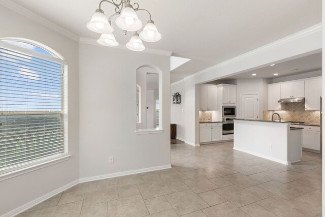 9617 Solana Vista Loop Unit A, Austin, TX 78750 - kitchen featuring stainless steel appliances, backsplash, ornamental molding, a chandelier, and white cabinets