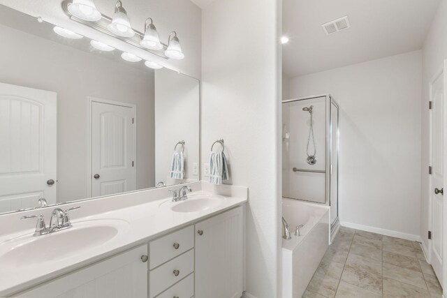9617 Solana Vista Loop Unit A, Austin, TX 78750 - full bath with a shower with shower door, a bath, double vanity, and baseboards