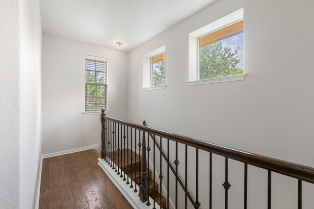 9617 Solana Vista Loop Unit A, Austin, TX 78750 - hallway with wood finished floors, an upstairs landing, and baseboards