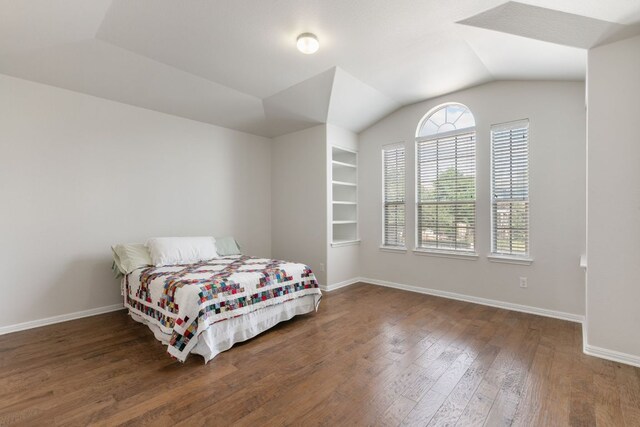 9617 Solana Vista Loop Unit A, Austin, TX 78750 - bedroom with wood finished floors, lofted ceiling, and baseboards