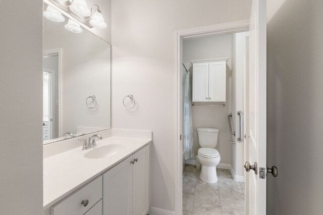 9617 Solana Vista Loop Unit A, Austin, TX 78750 - full bathroom with vanity, toilet, baseboards, and curtained shower