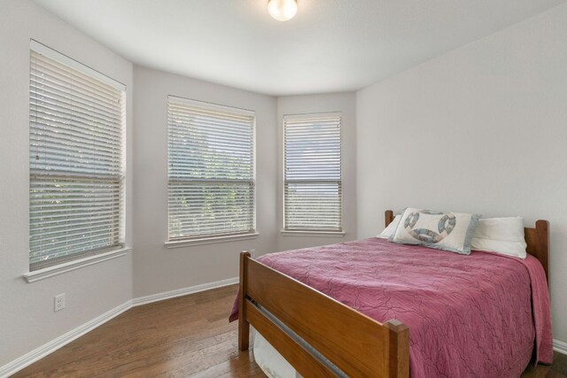 9617 Solana Vista Loop Unit A, Austin, TX 78750 - bedroom with wood finished floors and baseboards