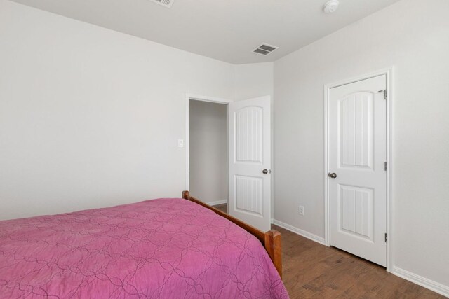 9617 Solana Vista Loop Unit A, Austin, TX 78750 - bedroom featuring wood finished floors and baseboards