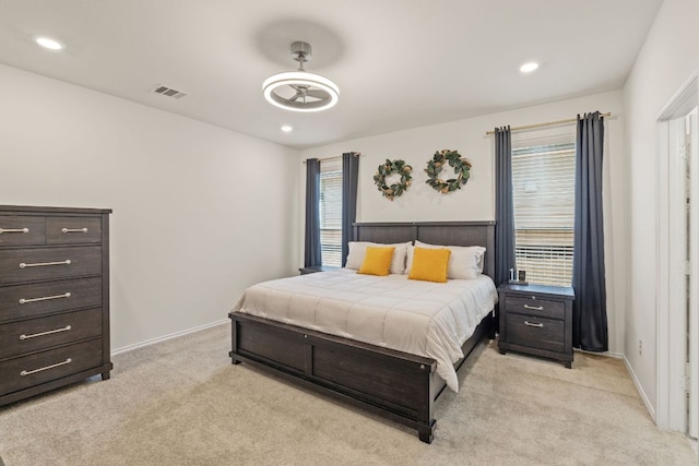 bedroom with light carpet, recessed lighting, and baseboards