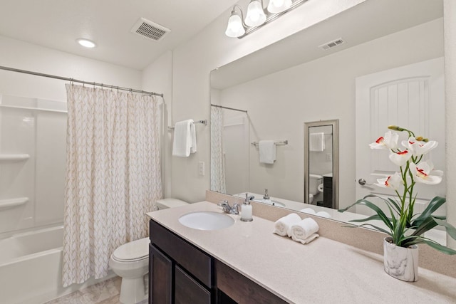 full bathroom featuring toilet, vanity, and shower / bath combo