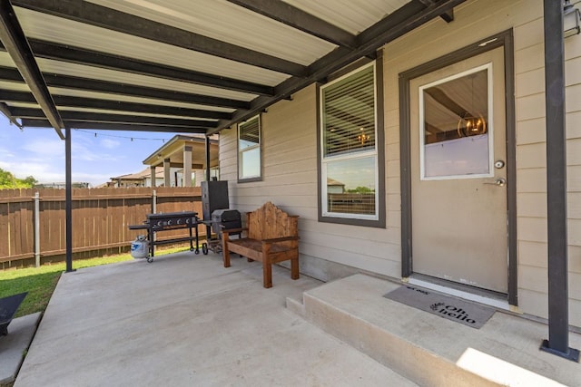 view of patio featuring fence