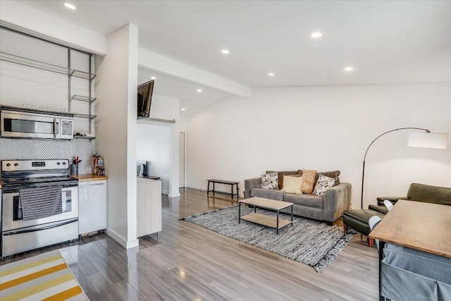 1304 Mariposa Dr Unit 214, Austin, TX 78704 - living room with wood finished floors and recessed lighting