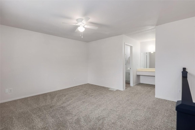 2201 Mission Hill Cir, Austin, TX 78741 - unfurnished bedroom featuring carpet floors, ceiling fan, and ensuite bathroom