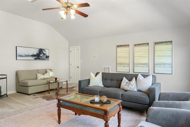 living room with lofted ceiling, a ceiling fan, baseboards, and light colored carpet