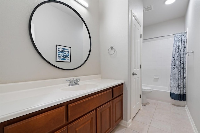 full bathroom featuring tile patterned flooring, vanity, baseboards, shower / bath combo with shower curtain, and toilet