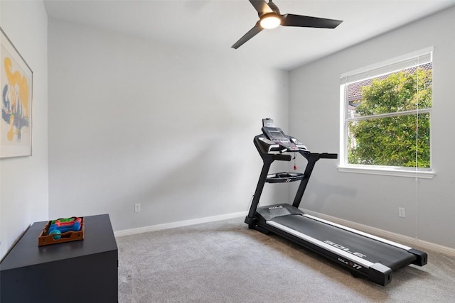 workout room with carpet, a ceiling fan, and baseboards