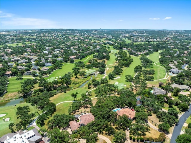 aerial view of residential area featuring a golf club and a nearby body of water