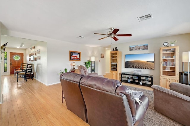 866 Bella Vista Cir, Kyle, TX 78640 - living area with ceiling fan, light wood-style floors, and baseboards