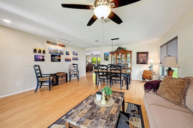866 Bella Vista Cir, Kyle, TX 78640 - living area with ceiling fan, light wood-style flooring, and baseboards