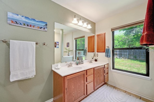 866 Bella Vista Cir, Kyle, TX 78640 - full bathroom featuring double vanity and baseboards