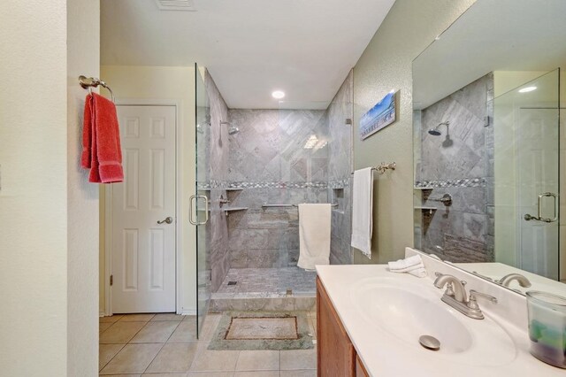 866 Bella Vista Cir, Kyle, TX 78640 - full bathroom featuring a stall shower, tile patterned floors, vanity, and recessed lighting