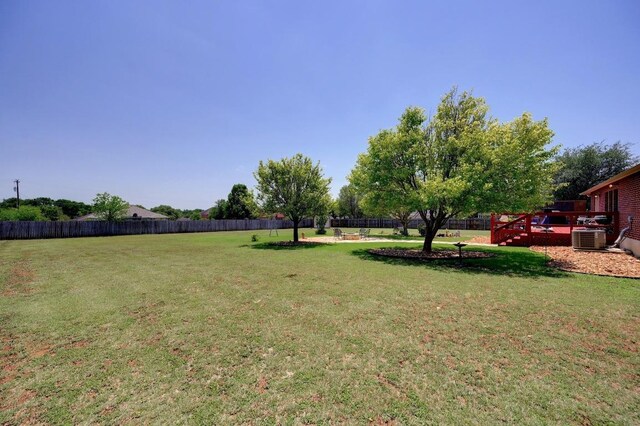 866 Bella Vista Cir, Kyle, TX 78640 - view of yard with a wooden deck and cooling unit