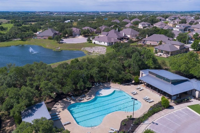 1505 Jolie Rose Bnd, Leander, TX 78641 - aerial view of residential area featuring a large body of water and a pool area