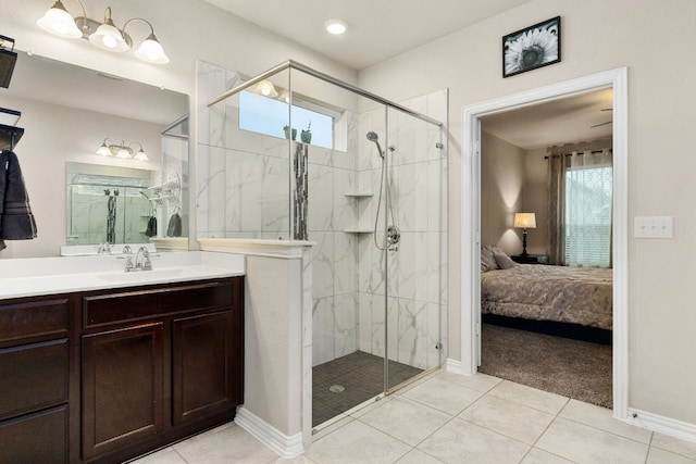 1012 Swan Flower St, Leander, TX 78641 - ensuite bathroom with a marble finish shower, tile patterned floors, and vanity