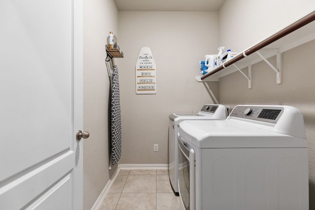 1012 Swan Flower St, Leander, TX 78641 - laundry area with washer and dryer and light tile patterned floors