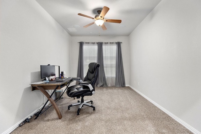 office space with light carpet, ceiling fan, and baseboards