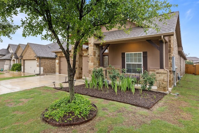 1012 Swan Flower St, Leander, TX 78641 - view of front facade with driveway, a garage, stucco siding, stone siding, and a shingled roof