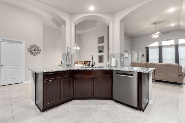 1012 Swan Flower St, Leander, TX 78641 - kitchen with dishwasher, light stone countertops, a ceiling fan, open floor plan, and lofted ceiling