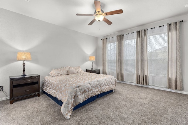 bedroom featuring carpet flooring, ceiling fan, and baseboards